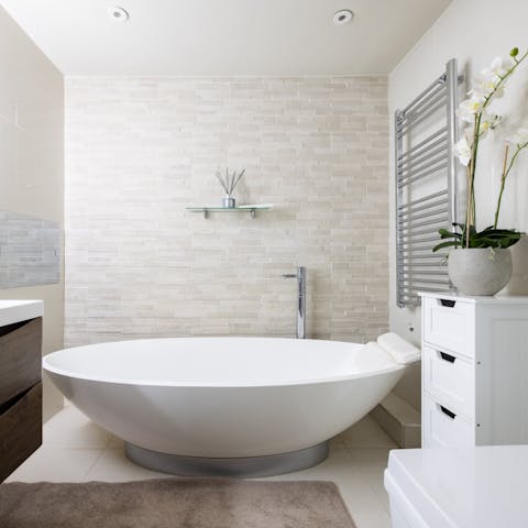 Soak your troubles away in the master bathtub