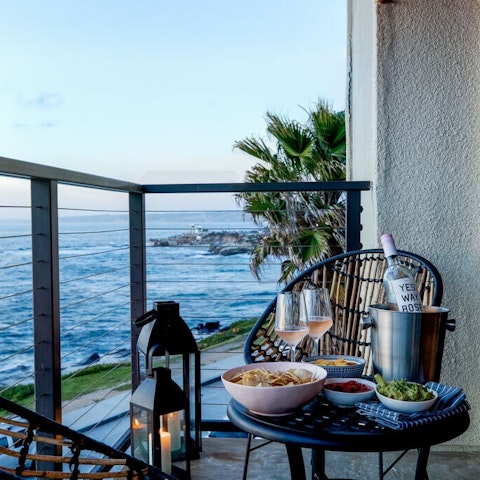 Savour a glass of rosé whilst taking in the pristine ocean views from the balcony