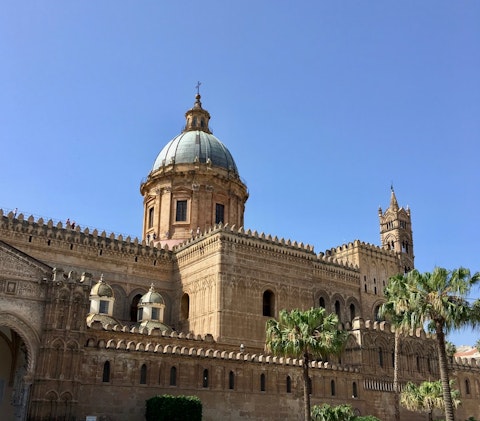 Walk five minutes to Palermo Cathedral, a stunning Norman-Arab architectural masterpiece