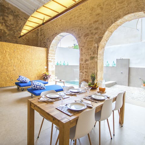 Enjoy a refreshing dip in the pool and then gather around the table for a magical evening in the courtyard