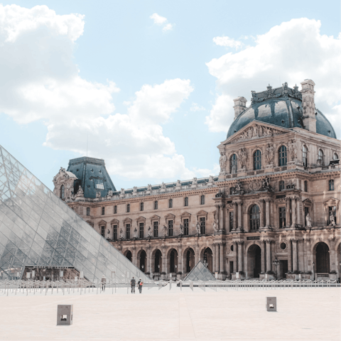 Visit the stunning Louvre Museum, a short walk away