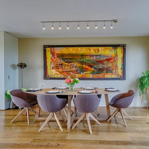 Watch the distant Parisian lights sparkle over dinner