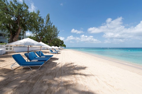 Unwind on the pristine sands of Paynes Bay Beach, just steps away