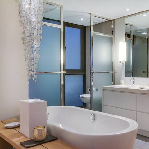 Grab a glass of Chardonnay and treat yourself to a long soak in the standalone bathtub