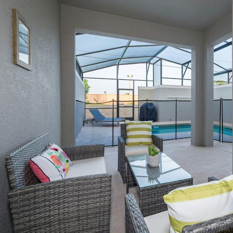 Lounge by the pool with a cold drink and a book