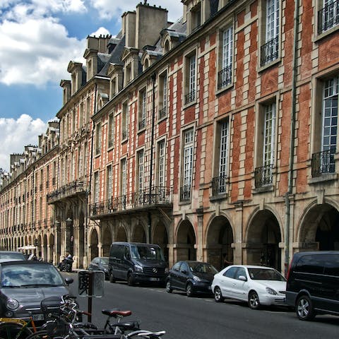 Enjoy a croissant in the historic Place de Voges square, just a thirteen-minute walk away
