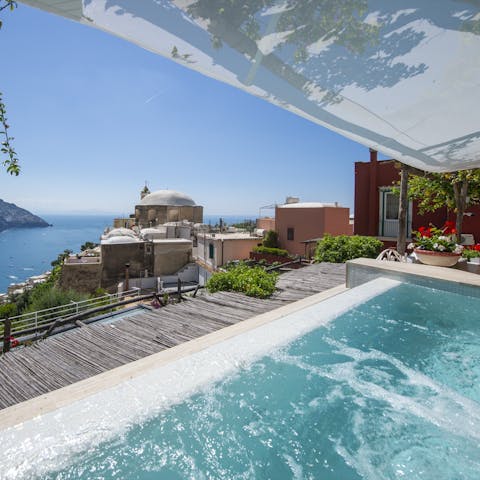 Soak in the jacuzzi pool with views across the bay