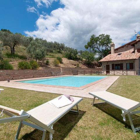 Catch some sun by the shared swimming pool