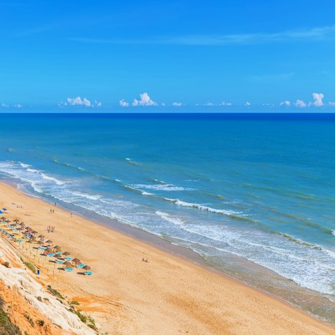 Take the ten-minute drive down to Praia de Albufeira for sunbathing and picnics on the sand