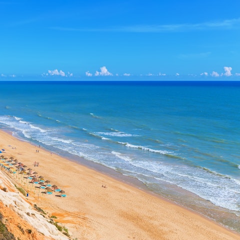 Take the ten-minute drive down to Praia de Albufeira for sunbathing and picnics on the sand