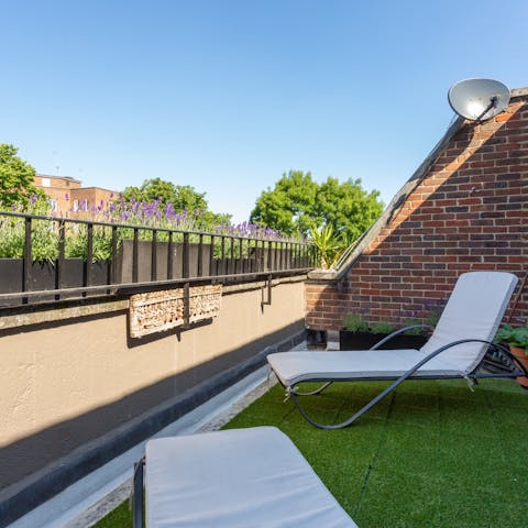 Take your morning iced latte up to the sun loungers on the balcony