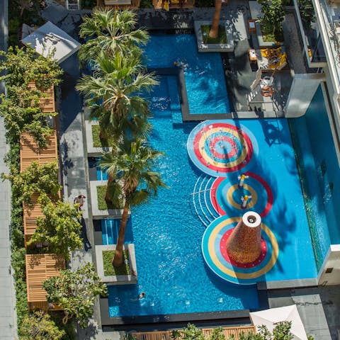 While away sunny afternoons in the communal outdoor pool