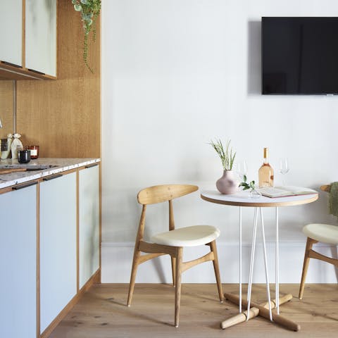 Cook up culinary perfection in the compact kitchen before sitting down to dinner in the open-plan living space