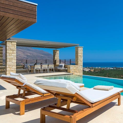 Soak up the sun on a lounger before cooling off with a swim in your private pool