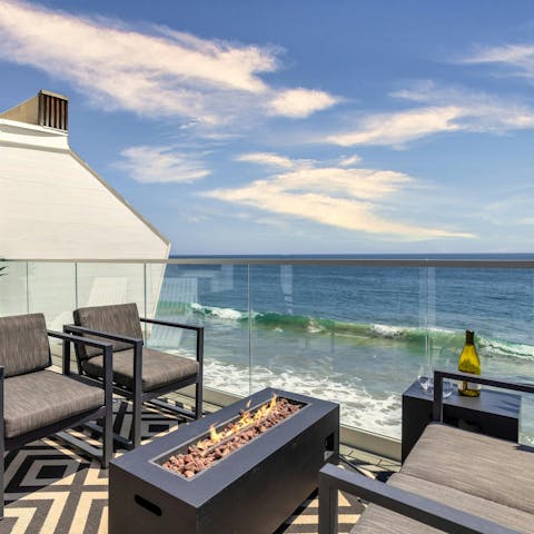 Savour magical sun set drinks while relaxing by the fire pit