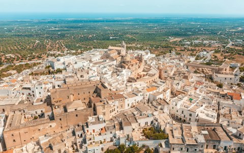 Discover the whitewashed wonders of Ostuni, thirty minutes by car