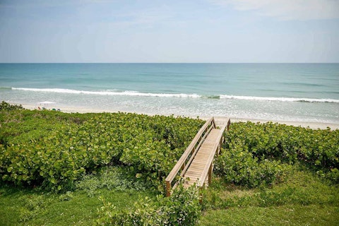 Relax on the soft sands of Melbourne Beach, just footsteps away