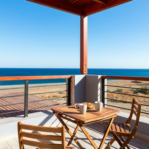 Admire the fantastic Aegean Sea vistas from the balcony