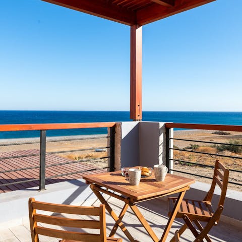 Admire the fantastic Aegean Sea vistas from the balcony
