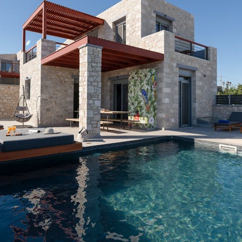 Relax in the Greek sun next to the private pool