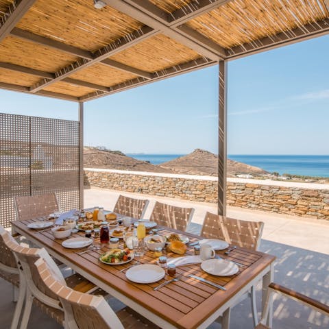 Eat and drink in the shaded patio area overlooking blue skies and aqua waters