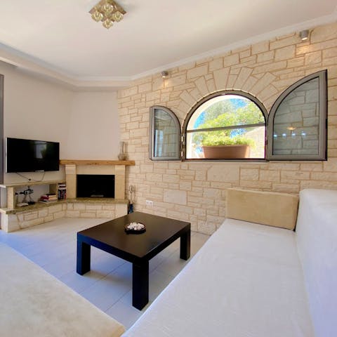 Snuggle up in front of the fireplace and relax with your loved ones in a calming space
