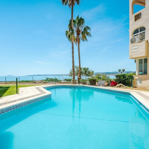 Take a break from the sand and sea with a swim in the communal pool