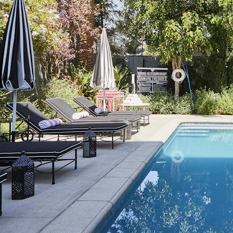 Get comfy on a sun lounger by the communal pool
