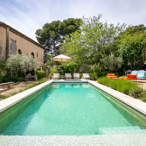 Swim gentle laps in the private pool, secluded by lush greenery