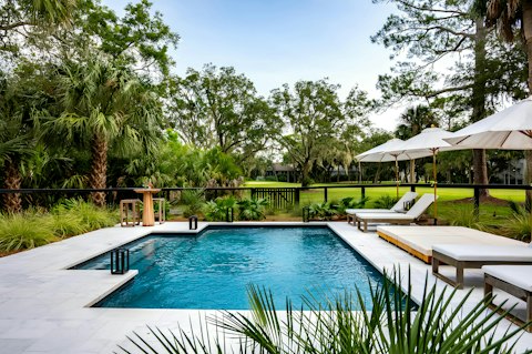 Swim beneath the oak trees overlooking the golf course