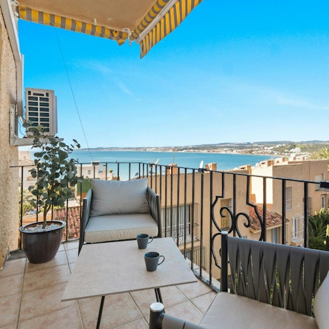 Unwind on the private balcony with drinks