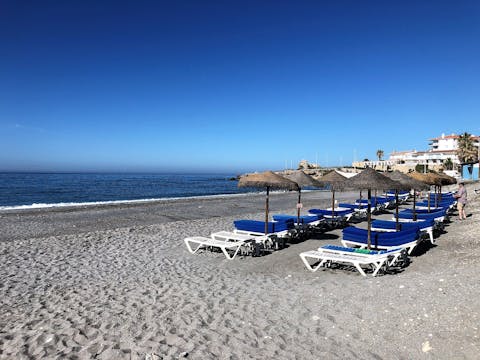 Saunter down to Torrecilla Beach melting into the Alboran Sea, just 250 metres away