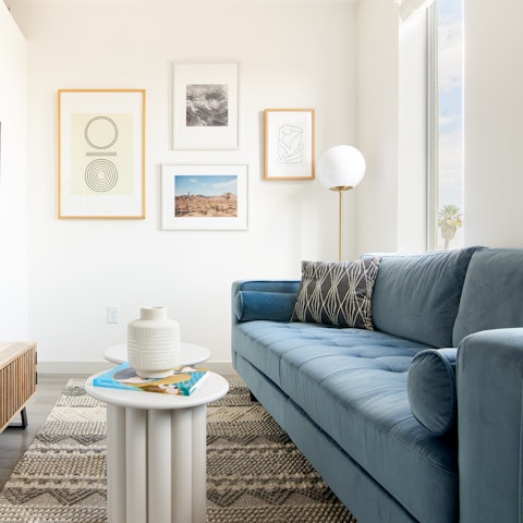 Admire the curated selection of ceramics and wall art in the living room