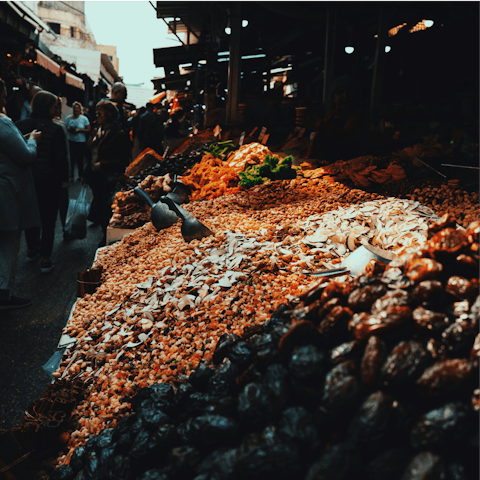 Browse delicacies at Shouk HaCarmel, a five-minute walk away