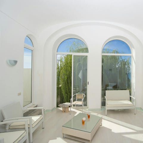 Enjoy a glass of wine in the sun-kissed seating area