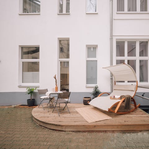 Spend warmer days on the private terrace, drinking coffee with your new book