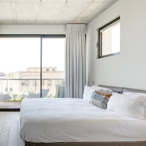 Head out from the bedroom to the balcony for your first coffee of the day