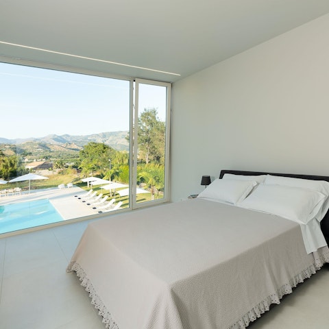 Wake up to views of the Sicilian mountains