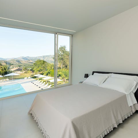 Wake up to views of the Sicilian mountains