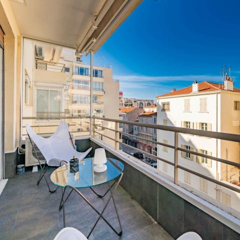 Have a glass of French rosé wine on the private balcony