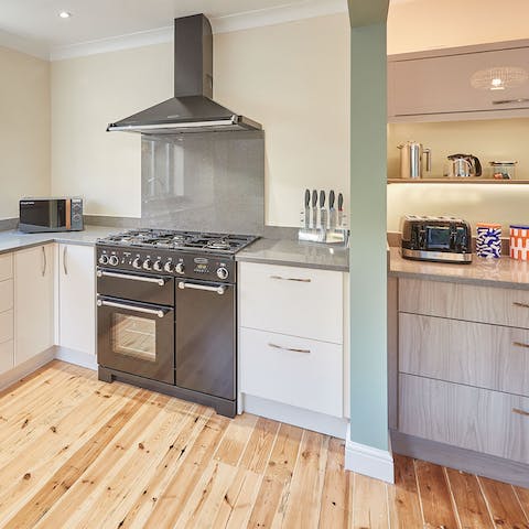 Flex your culinary muscles in the sleek, modern kitchen