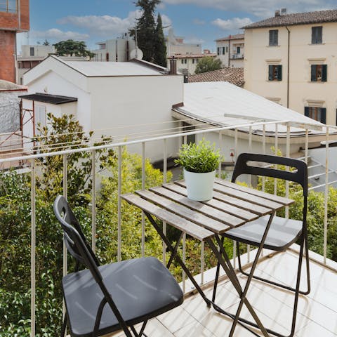 Sip a glass of wine on the private balcony as the sun warms your skin