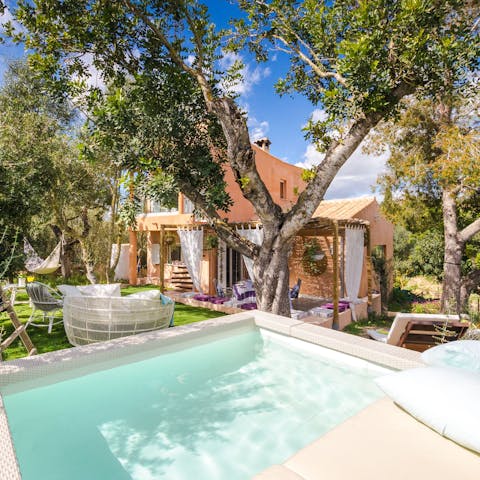 Soak in the private hot tub, drink in hand