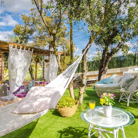 Swing in the garden hammocks under the shade of the trees