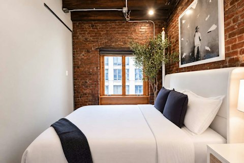 Unwind after a day exploring Manhattan in the exposed-brick bedrooms