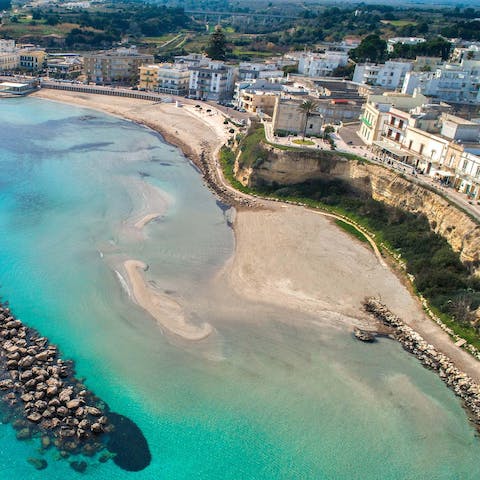 Spend lazy afternoons down at the local beach, just five-hundred metres from your door