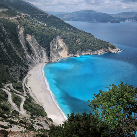 Swim in the sea at Paralia Lourdata – you can walk there in twenty minutes