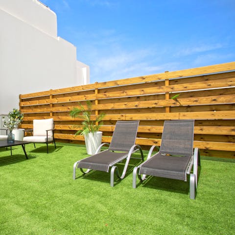 Flop down on a lounger and soak up the sun on the terrace