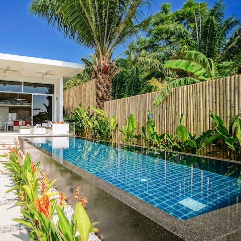 Enjoy a refreshing dip in the outdoor pool with a tasty cocktail in hand