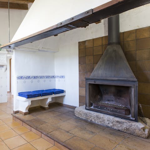 Admire the preserved 19th-century features of this home, like the kitchen's old hearth